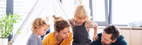 A young family enjoying reading time in their Coachella Valley home