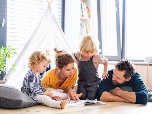 A young family enjoying reading time in their Coachella Valley home